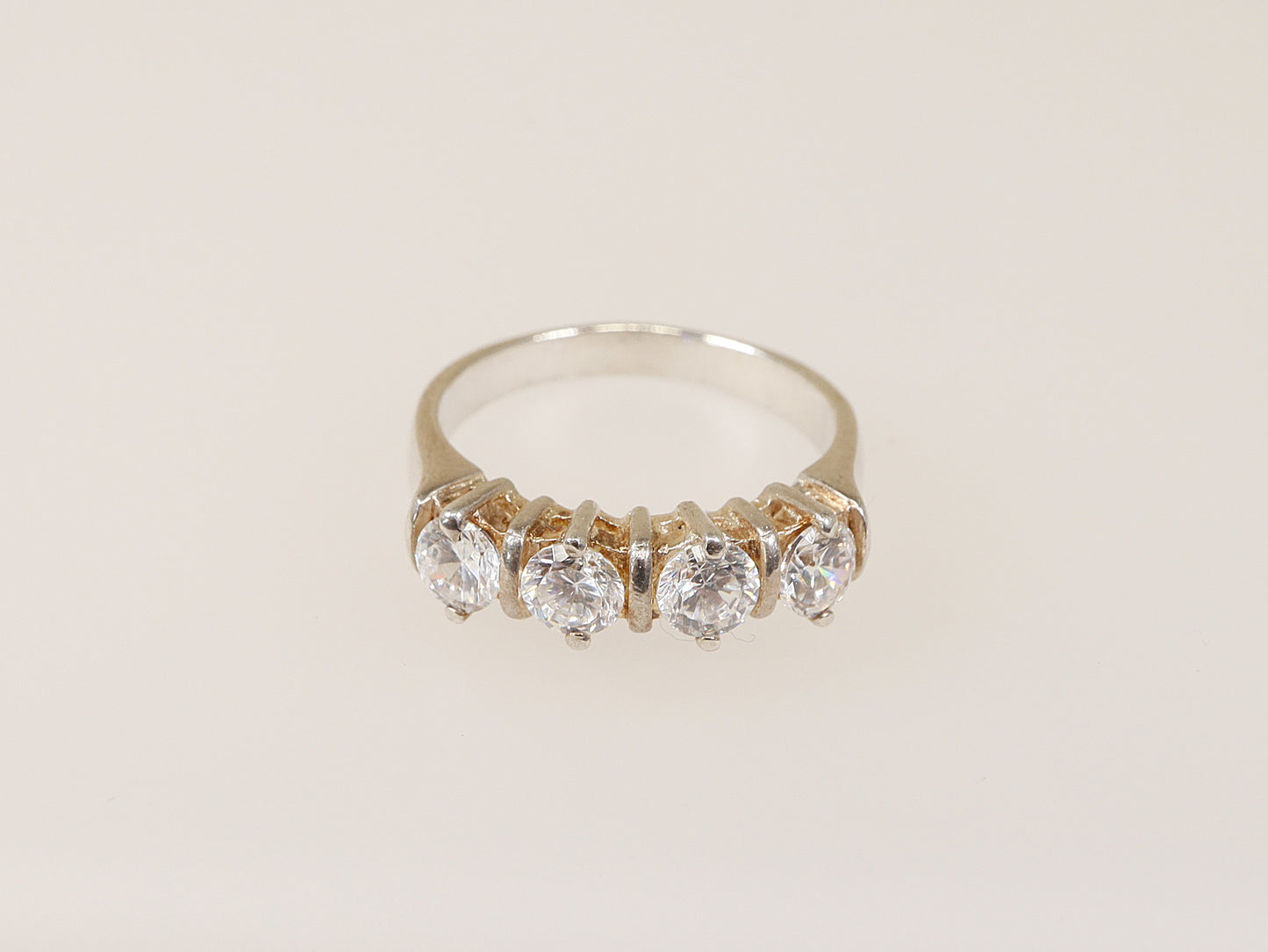 This lovely Sterling Silver ring has 4 claw set Cubic Ziconia gemstones that have all the style and elegance of a real diamond, looks just like the real thing.
The ring is stamped inside the band 925 for sterling silver. UK Finger Size: N .
