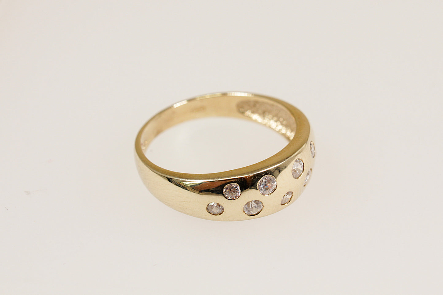 A 9ct Yellow Gold 9 stone scatter band ring.