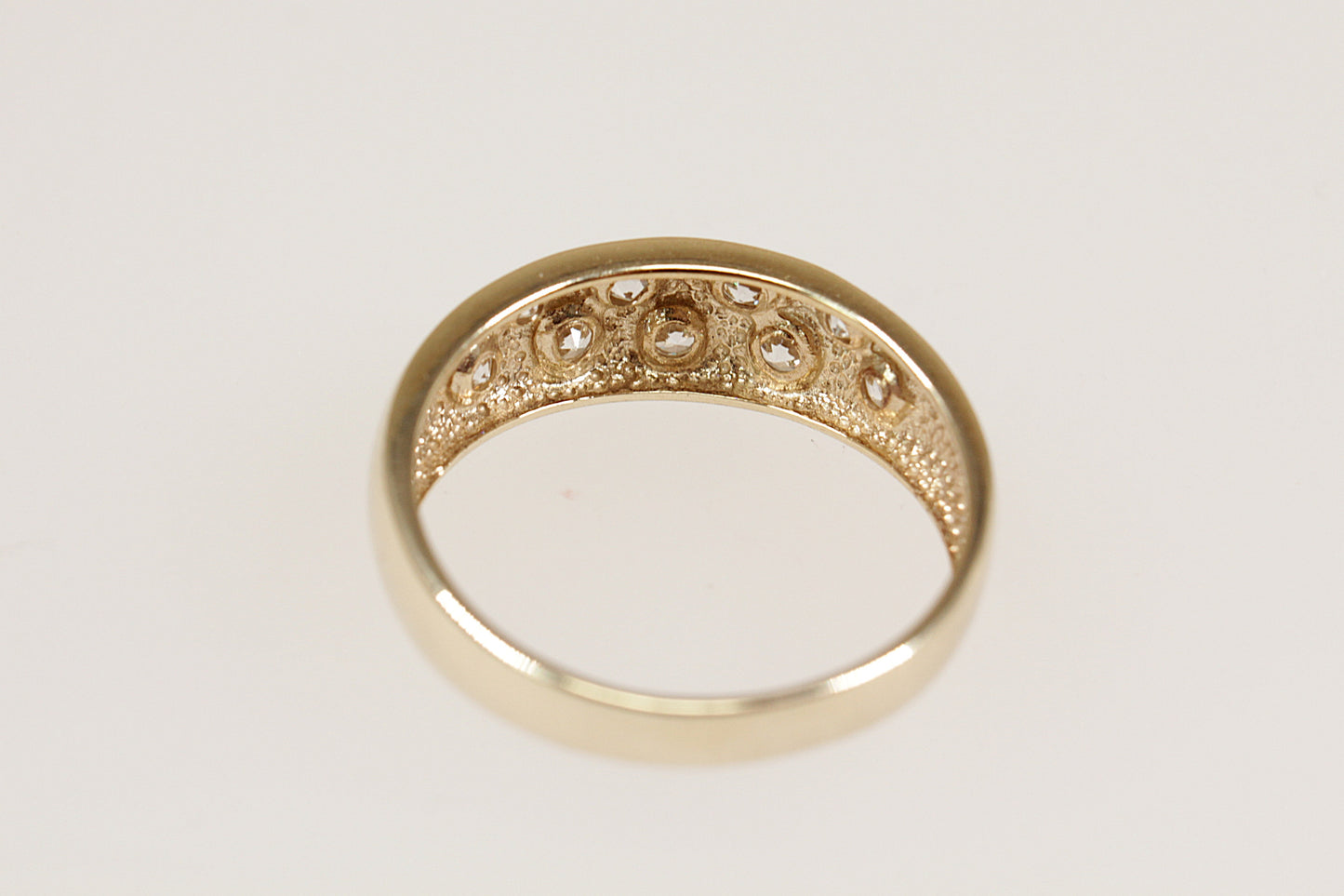 A 9ct Yellow Gold 9 stone scatter band ring.