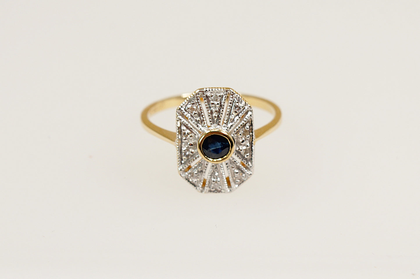 18ct art deco yellow and white gold sapphire and diamond ring.