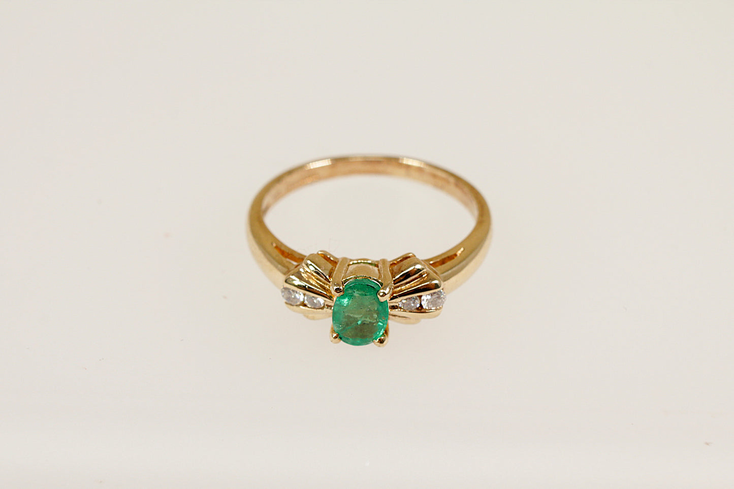 9ct yellow gold emerald and diamond ring.