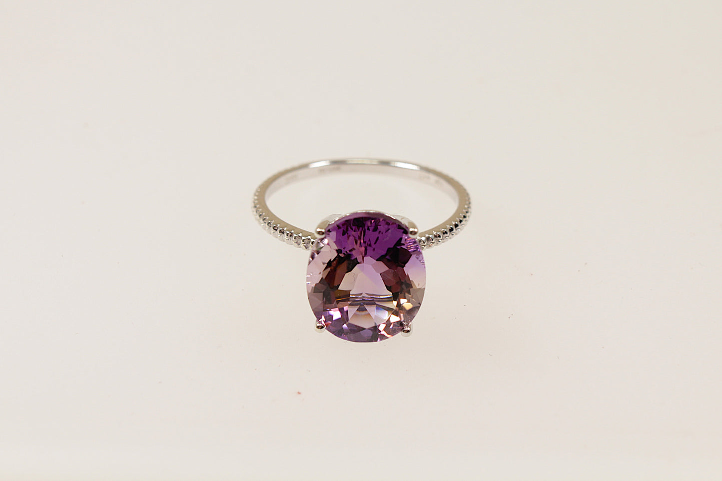 This stunning 9ct Gold solitaire features a captivating oval-shaped Amethyst gemstone; known for its sparkle and vibrant purple colour, UK finger size O.