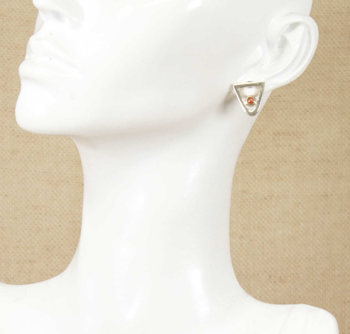 These pretty ear Silver Stud Earrings have a round cabochon Amethyst set into a triangular shaped silver setting.
They are in excellent condition, stamped 925 for sterling silver.