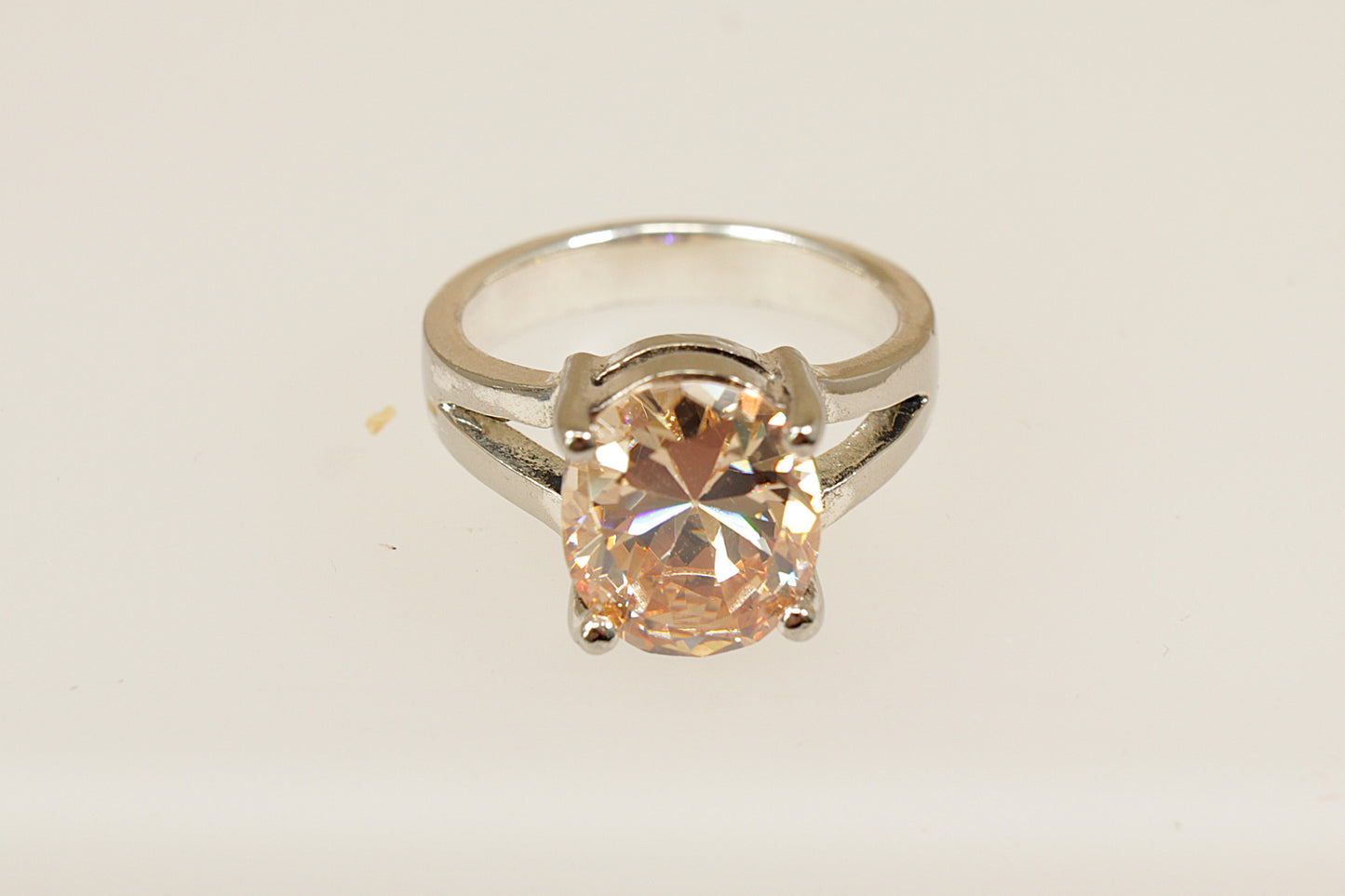 A Sterling Silver Citrine Coloured Crystal Solitaire Statement Ring stamped 925 for sterling silver, UK finger size Q.
