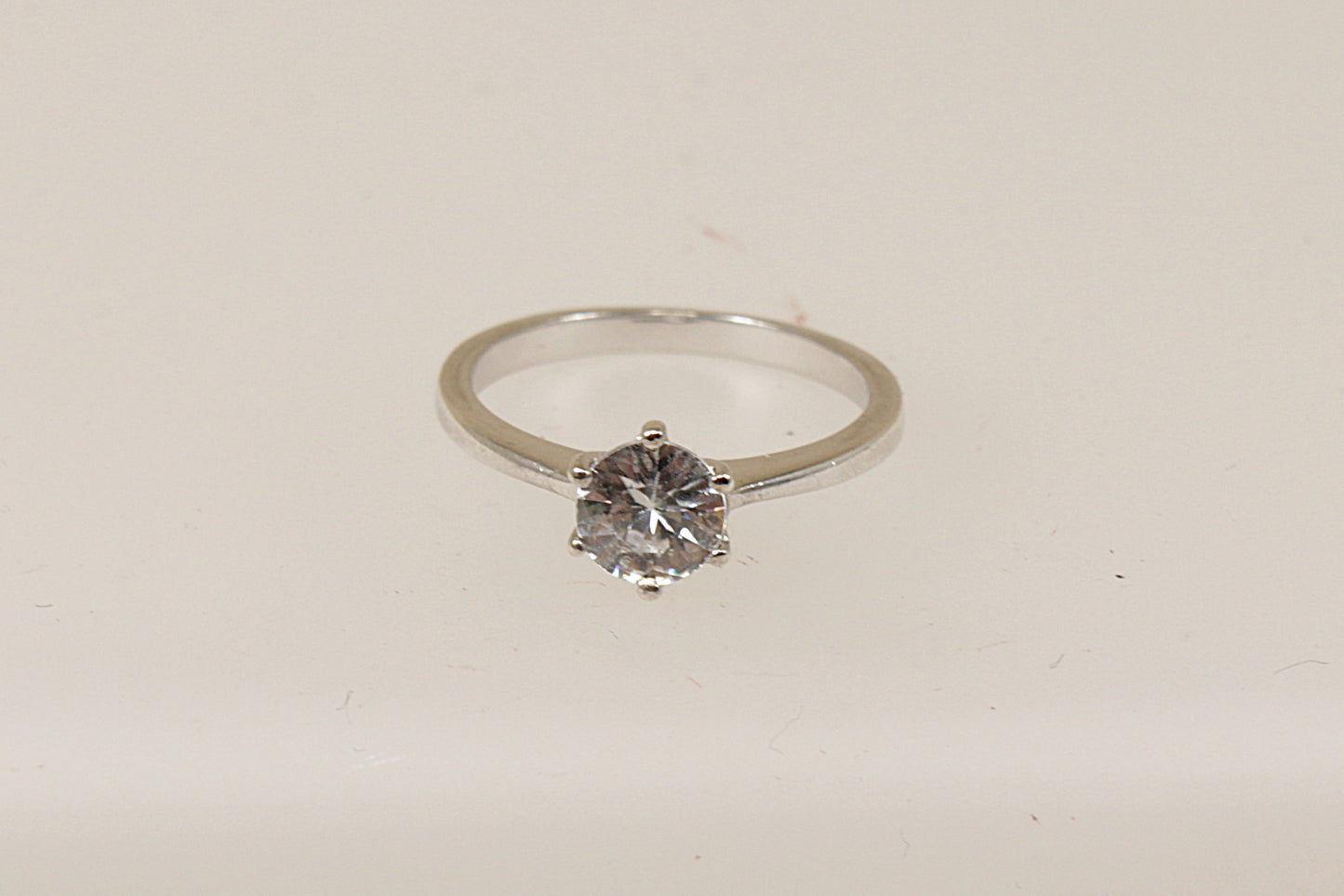 A sterling silver white topaz solitaire ring, Stamped 925 for sterling silver and the makers mark ‘TGGC’ for The Genuine Gemstone Company, UK finger size O.