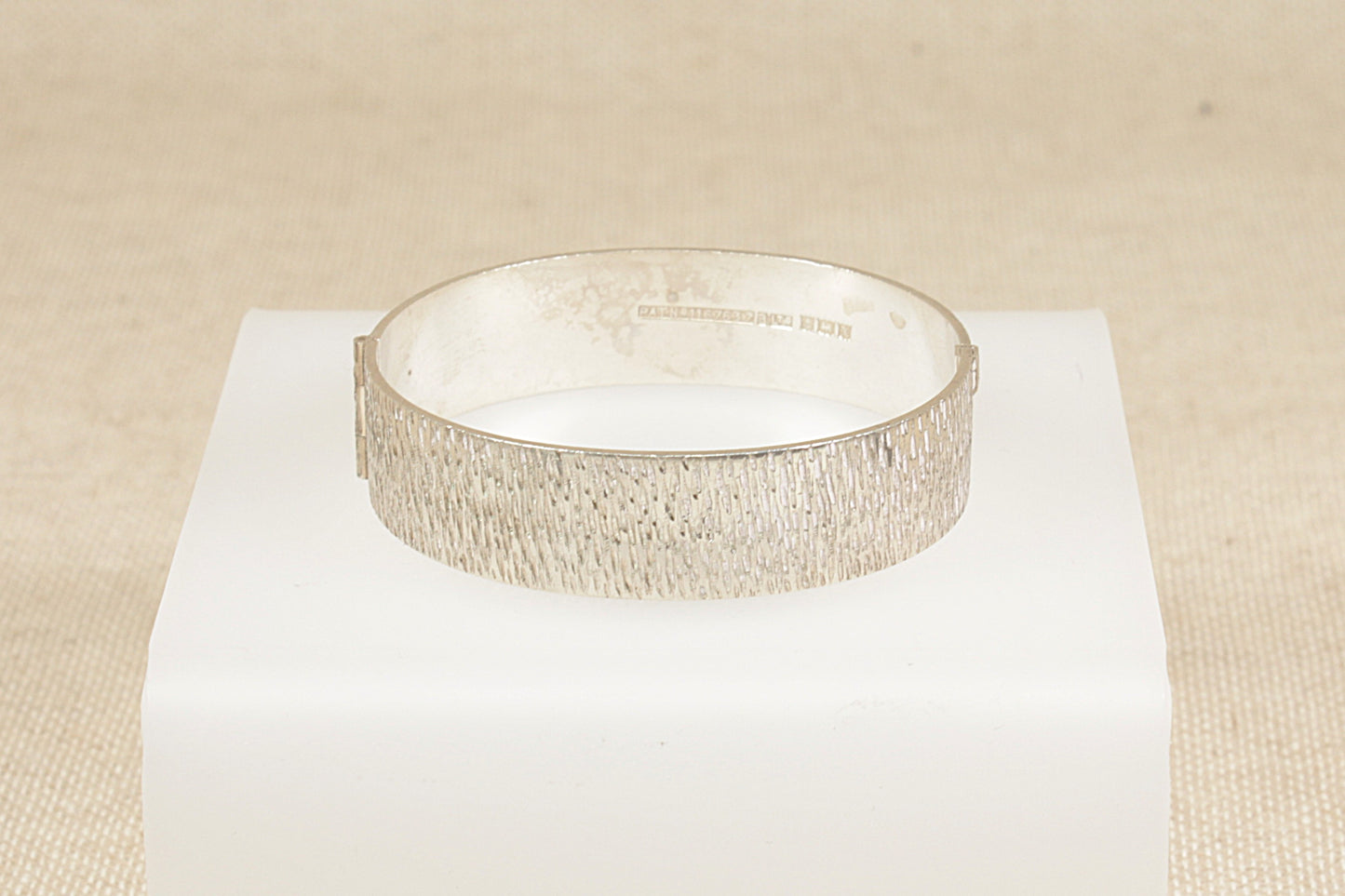 Vintage 1970's solid silver hinged bracelet bangle with bark effect finish.