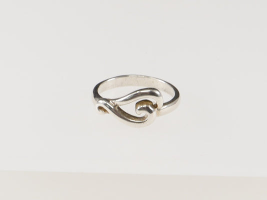 A sterling silver ring with a swirl design, displayed against a white background.