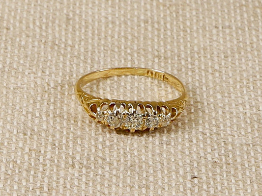 A stunning Antique 18ct 5 stone Diamond Ring with old cut Diamonds.
The ring is stamped inside the band with London hallmarks and 18 for 18ct gold. In our opinion we estimate this ring to be circa 1900. Weight of Diamonds 0.30 carat (estimated). 
UK Finger size P.