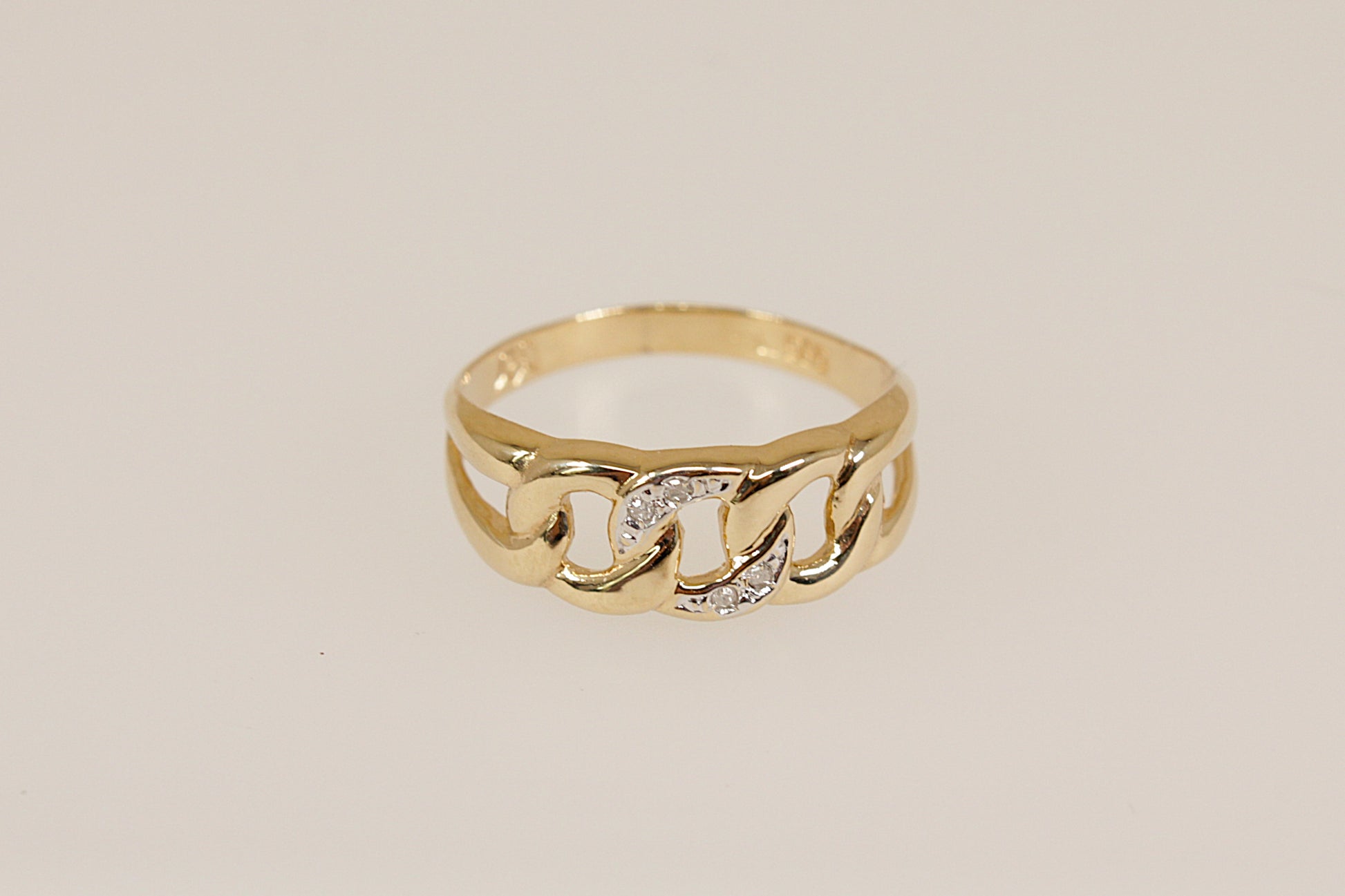 14ct Gold Diamond Knot Design Ring, 
A charming and symbolic 14ct gold ring, featuring a graceful triple knot design on the head, with sparkling diamond accents delicately set into the central loop. The split shoulders flow seamlessly into the knot motif, enhancing the fluidity and meaning of the design, Inside the band, the ring is stamped 585, indicating its 14ct gold purity, UK Finger size: N.
