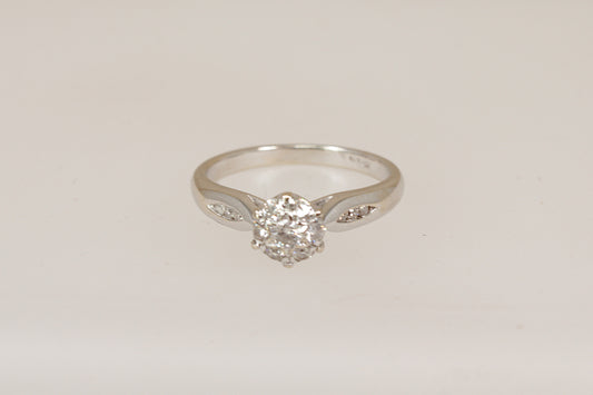 18ct white gold diamond cluster ring  on a light gray background