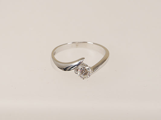 An 18ct white gold diamond solitaire ring with a twist design with a certified   0.41ct central diamond on a white background
