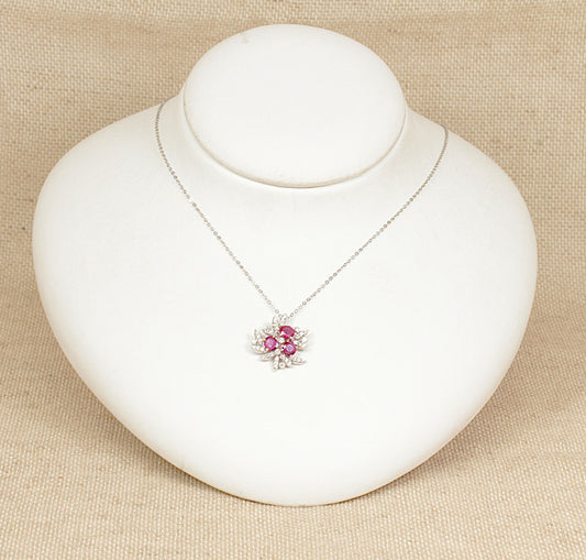 18ct white gold diamond and ruby pendant necklace stamped 0.93 carat for the rubies and 0.32 carat for the diamonds the pendant sits on a 18ct white gold 18 inch chain.