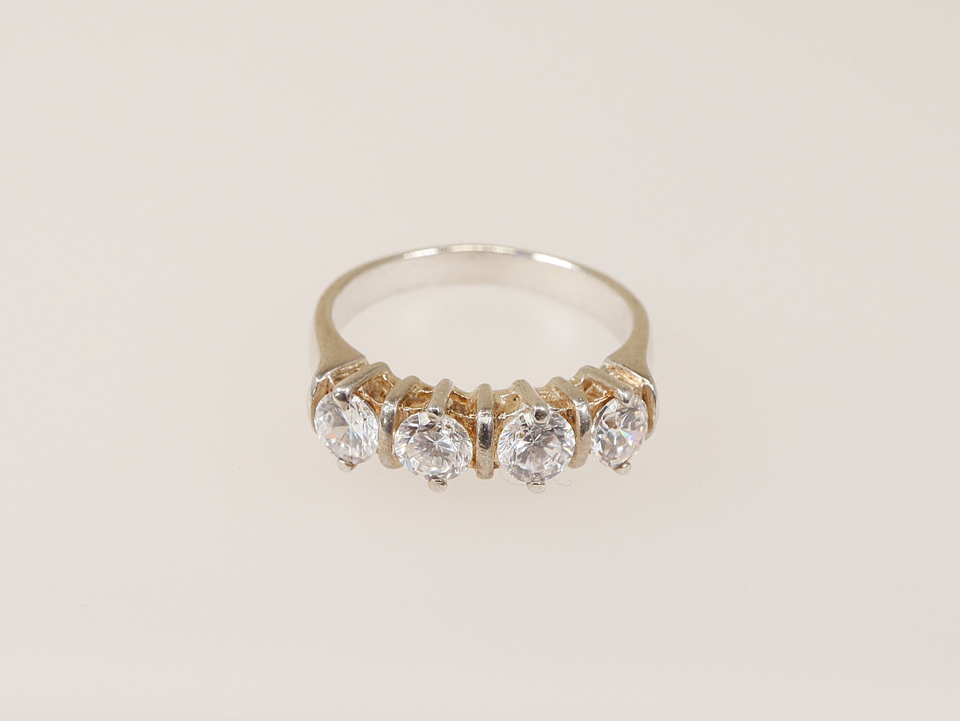 This lovely Sterling Silver ring has 4 claw set Cubic Ziconia gemstones that have all the style and elegance of a real diamond, looks just like the real thing.
The ring is stamped inside the band 925 for sterling silver. UK Finger Size: N .
