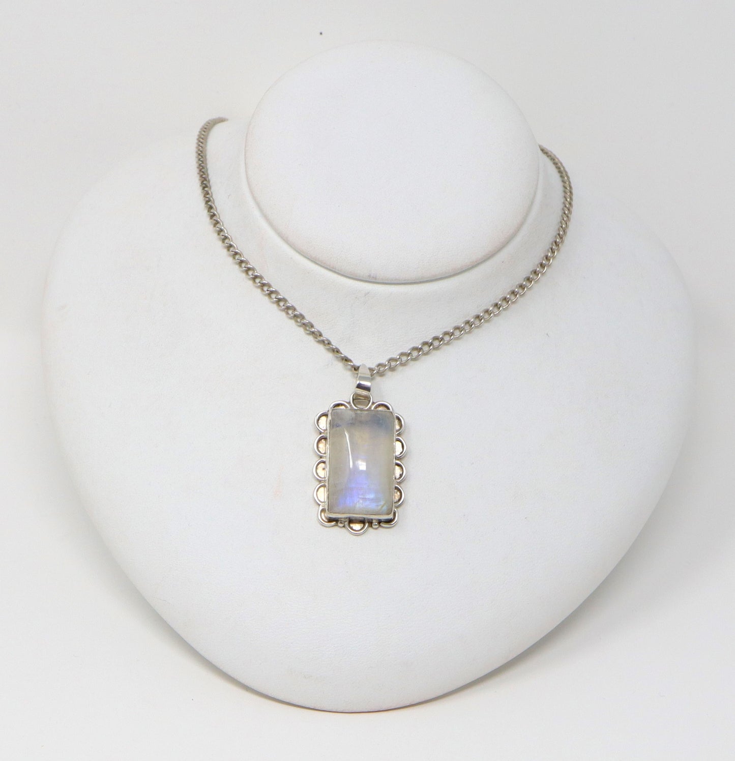 This striking pendant has a large rectangular piece of Moonstone set in a beautiful handcrafted silver setting.
The silver curb chain is 18 inches long.
It is in excellent condition and is stamped 925 for sterling silver.