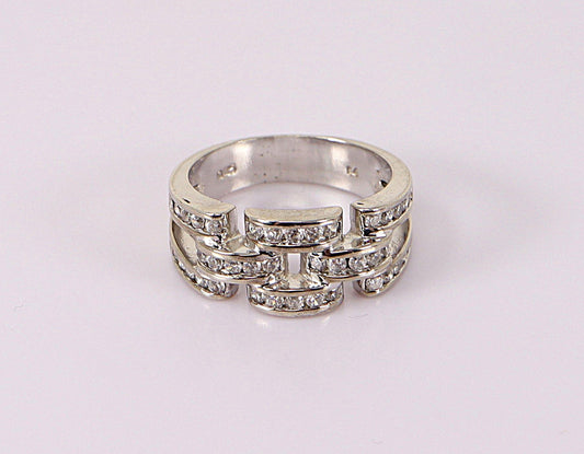 A silver band ring with cubic zirconia gemstones set along the band, viewed from the top on a white background.