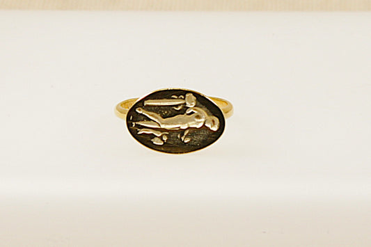 A vintage silver intaglio ring with a classical figure design carved into the top, displayed against a white background.