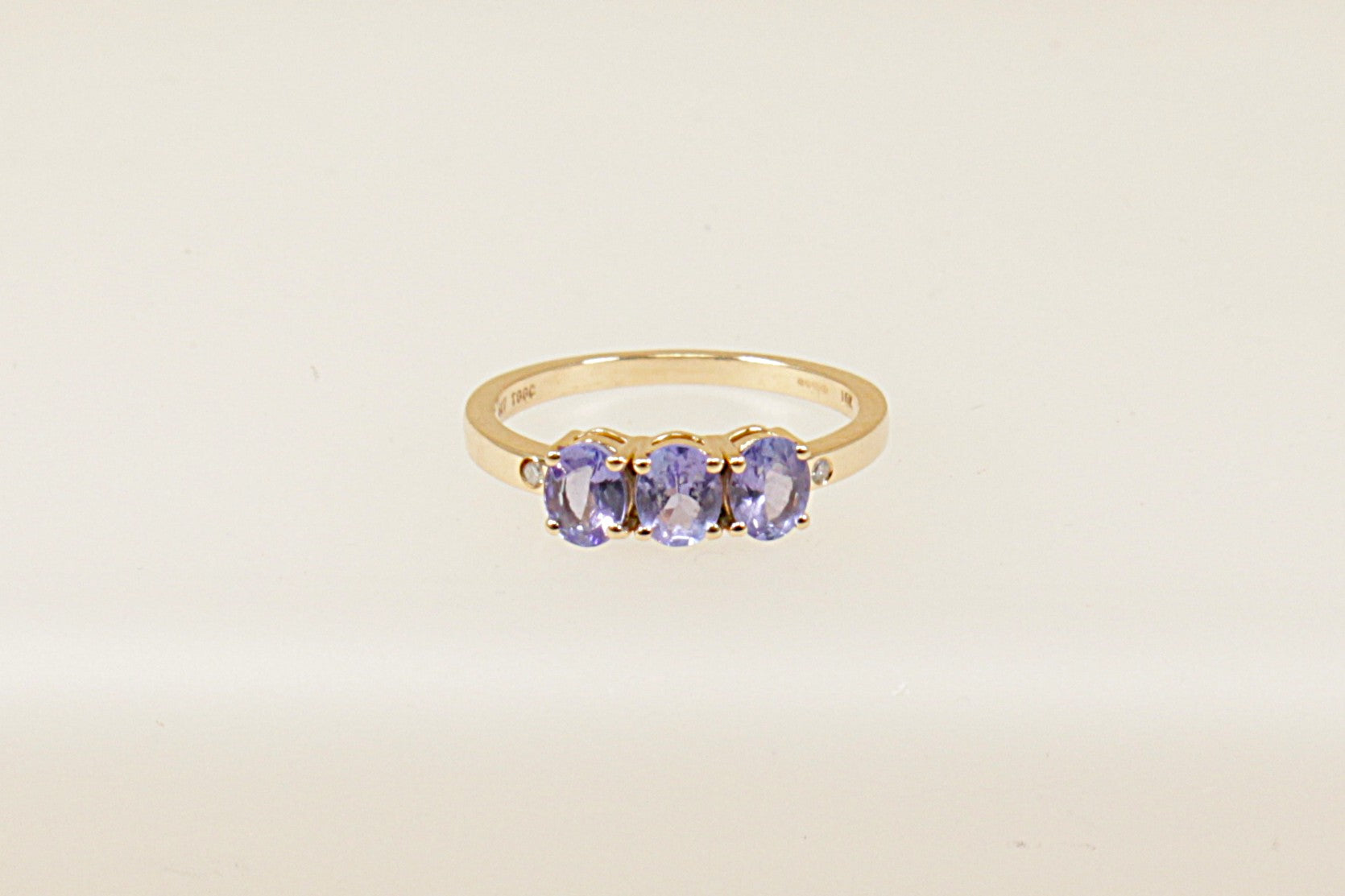 This ring is a stunning and unique piece thanks to the deep, captivating colour of Iolite, Blue Iolite is often referred to as "water sapphire", Each iolite stone is held in a secure 4 claw setting, which allows maximum light to pass through the gems and brings out their full colour and brilliance. UK finger size O.
