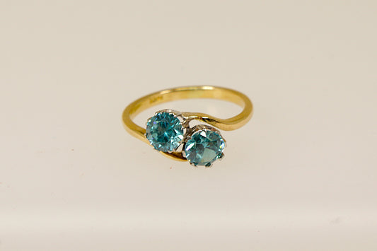 A vintage 18ct gold ring with two old-cut blue zircon gemstones.