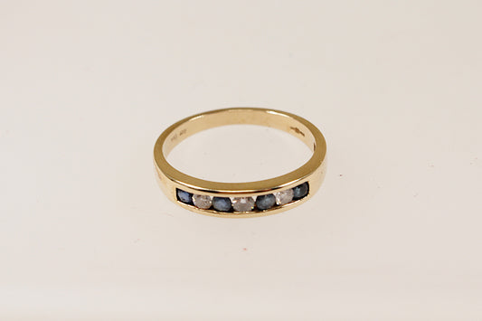 9ct yellow gold channel set blue sapphire and diamond band ring