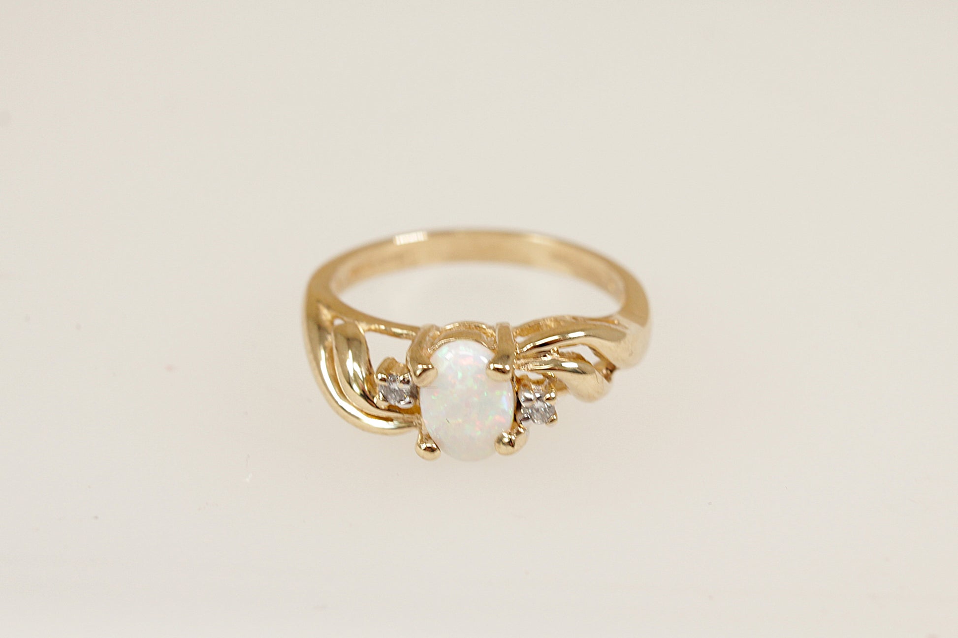 9ct yellow gold fire opal and diamond ring size N.