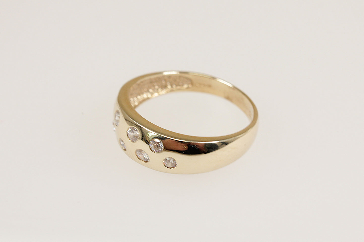 A 9ct Yellow Gold 9 stone scatter band ring.