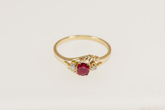 18ct yellow gold ruby and diamond trilogy ring.