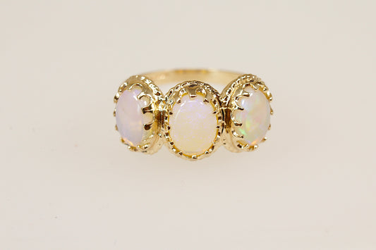 9ct yellow gold opal trilogy ring.
