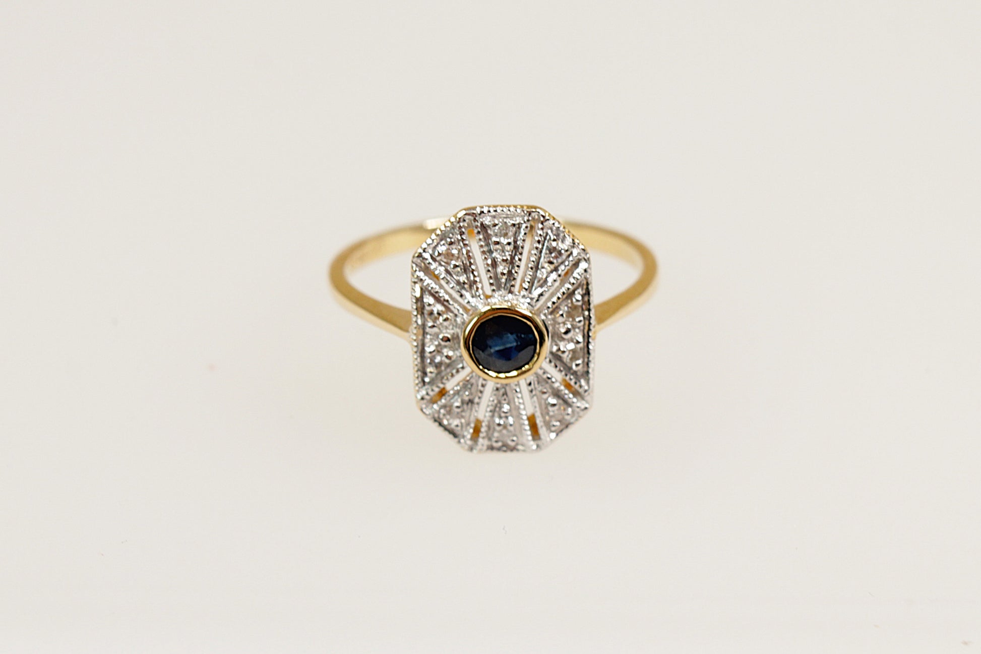 18ct art deco yellow and white gold sapphire and diamond ring.