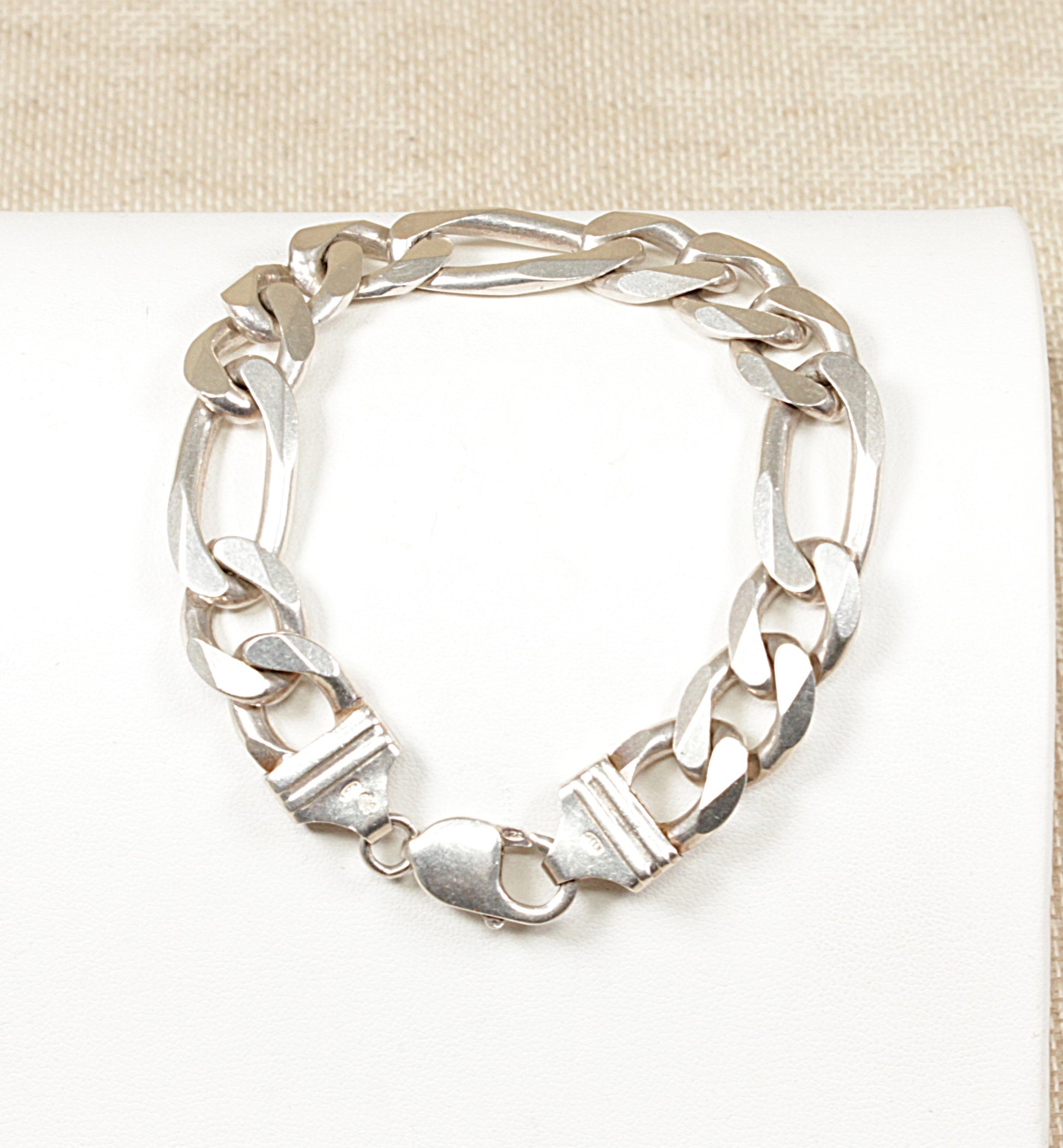 This Italian stylish Silver bracelet is high-quality and has the classic style Figaro link. It has a robust lobster clasp, the bracelet is in great condition and stamped Italy 925 for sterling silver.