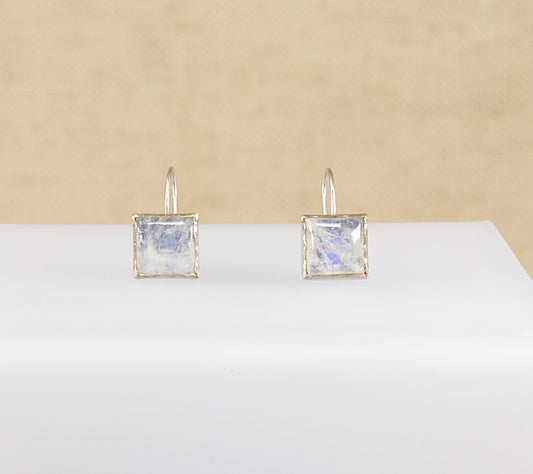These beautiful Moonstone earrings are square shaped and have a bold appearance that is bezel set with an artisan ‘studio’ feel. The moonstone has lovely blue flashes of iridescence.