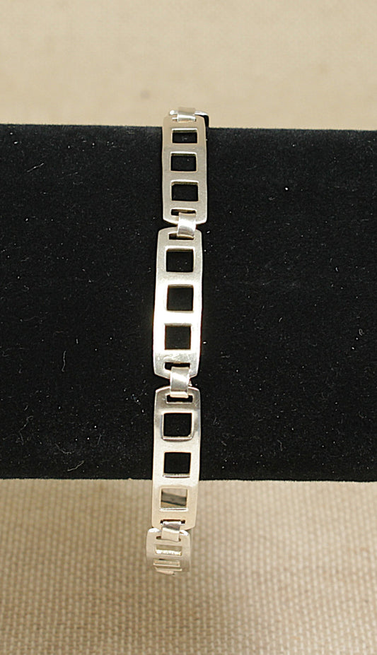 This stylish Silver bracelet has a timeless appeal with each rectangular articulated link having a cut out design; the flexibility on the links ensures a comfortable fit.