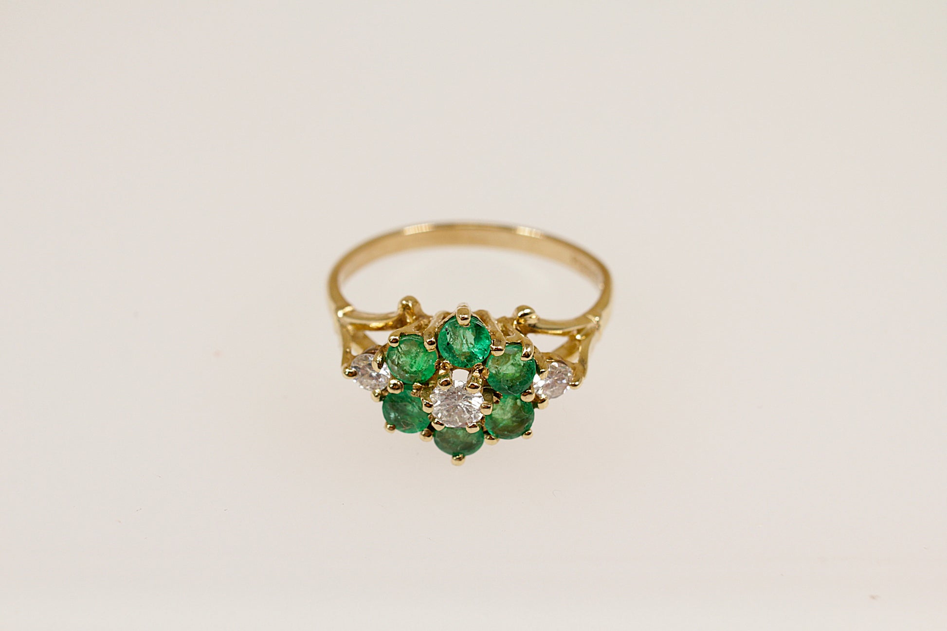 9ct yellow gold emerald and diamond cluster flower ring.