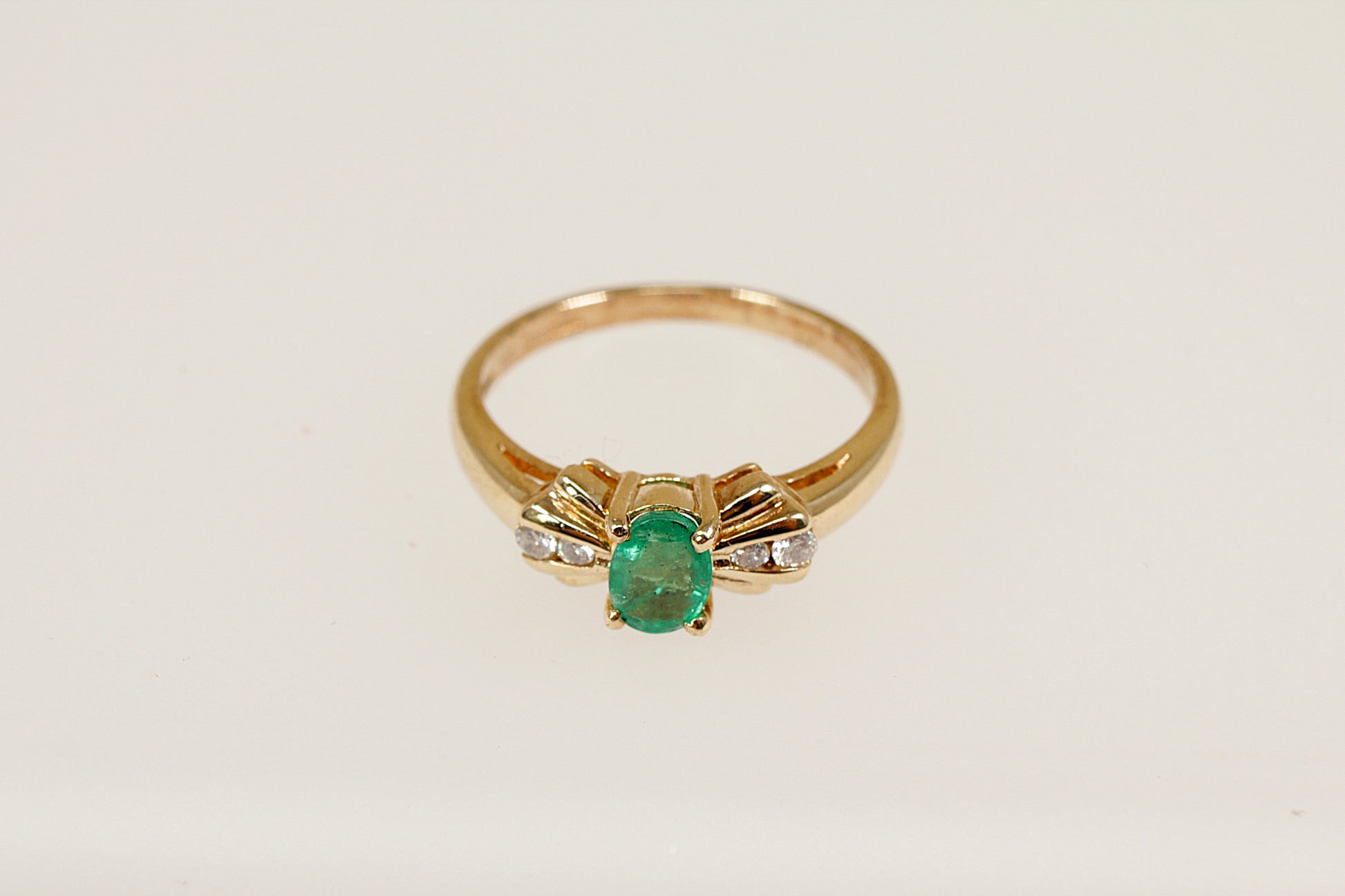 9ct yellow gold emerald and diamond ring.