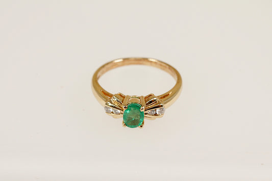 9ct yellow gold emerald and diamond ring.