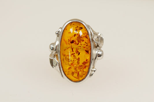 Baltic amber silver statement ring, On the outside of the band it has continental hallmarks, Polish? with the 925 stamp for sterling silver and the letters DC. UK finger size M.