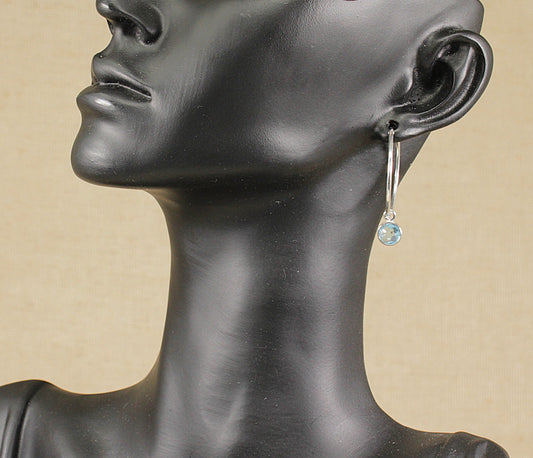 Sterling silver hoop earrings with topaz dropper.