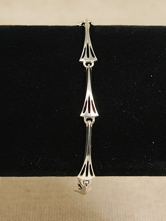 Silver bracelet on a black and beige background