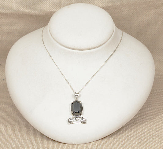 Necklace with a pendant on a white jewelry display