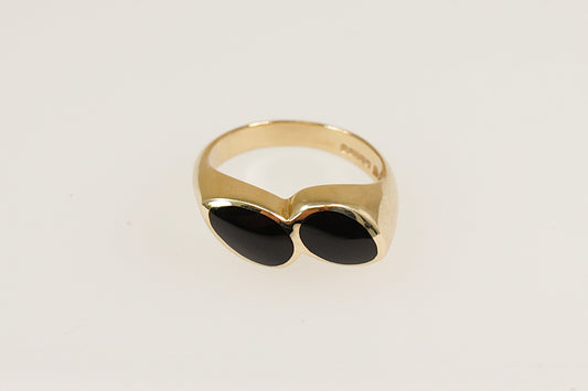 A 9ct gold ring with two pear-shaped pieces of black Whitby Jet, bezel set side by side at a subtle angle.