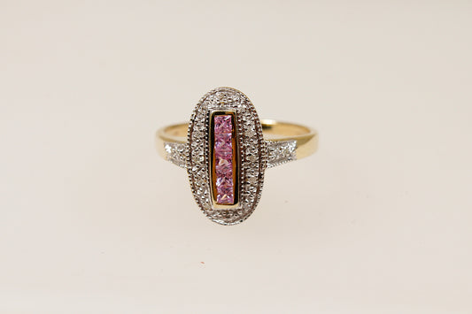 A 9ct gold ring with a vertical arrangement of pink sapphire stones and diamond accents around the oval design and on the shoulders.