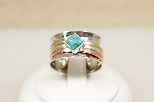 three tone sterling silver turquoise spinner ring.