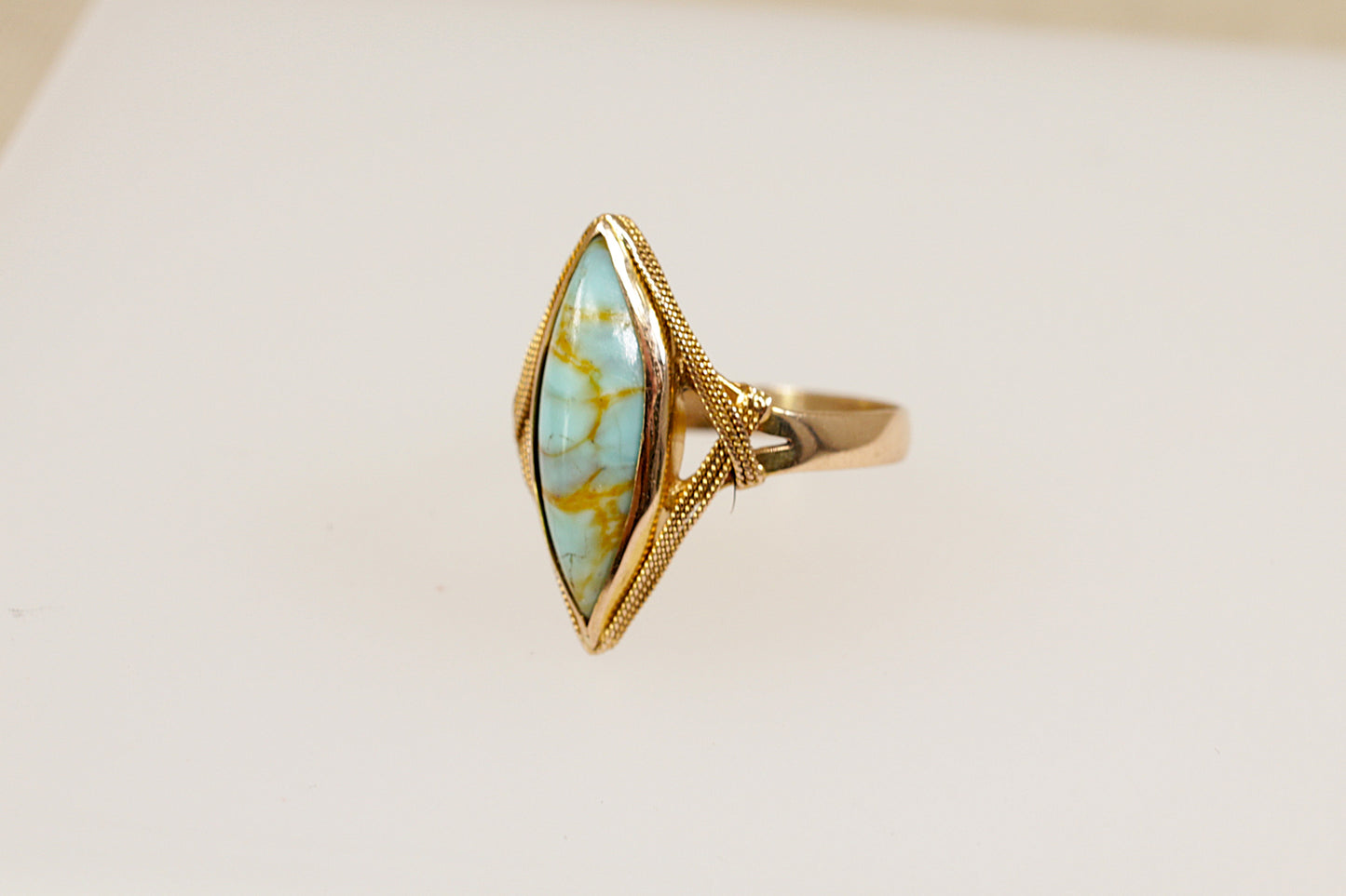 An 18ct yellow gold Art Deco genuine turquoise navette ring made with the richness of 18ct yellow gold.