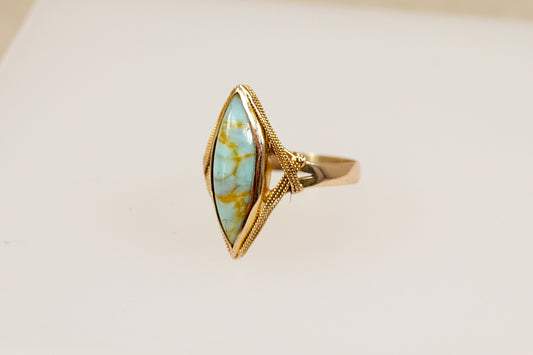 An 18ct yellow gold Art Deco genuine turquoise navette ring made with the richness of 18ct yellow gold.