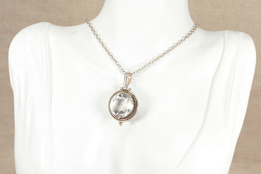 Art Deco Silver and Rock Crystal statement pendant necklace on a mannequin with a beige background