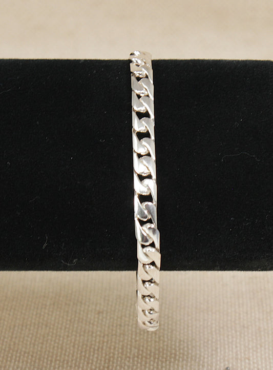 Silver Italian curb link chain bracelet on a black cushion