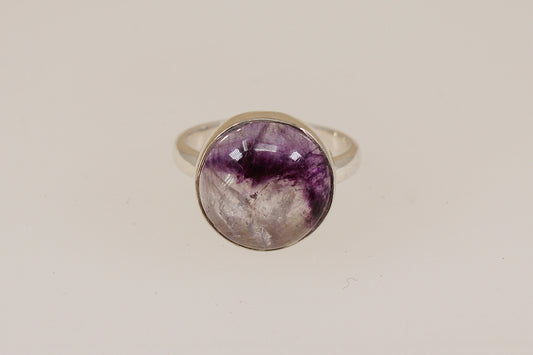 Silver ring with a rare sought after Blue John  gemstone on a beige background