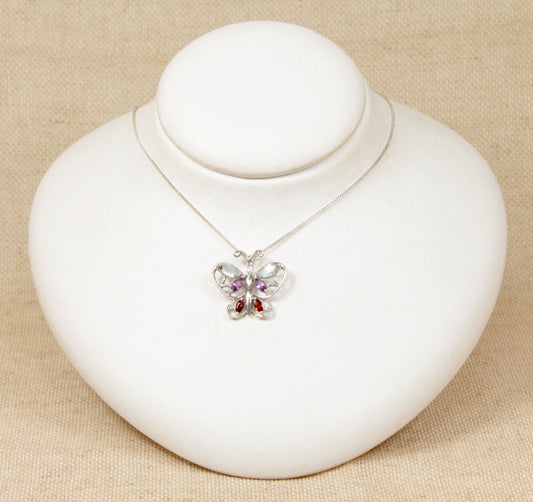 Silver Multi Gemstone, Diamond Butterfly Pendant and a Chain Necklace.
This beautiful Silver butterfly pendant has 6 coloured gemstones comprising of Blue Topaz, Amethyst and Garnet with a petite Diamond on the head of the butterfly. The pendant is stamped 925 for sterling silver and DIA for diamond on the back of the pendant.
The pendant sits on an 18 inch silver trace chain.