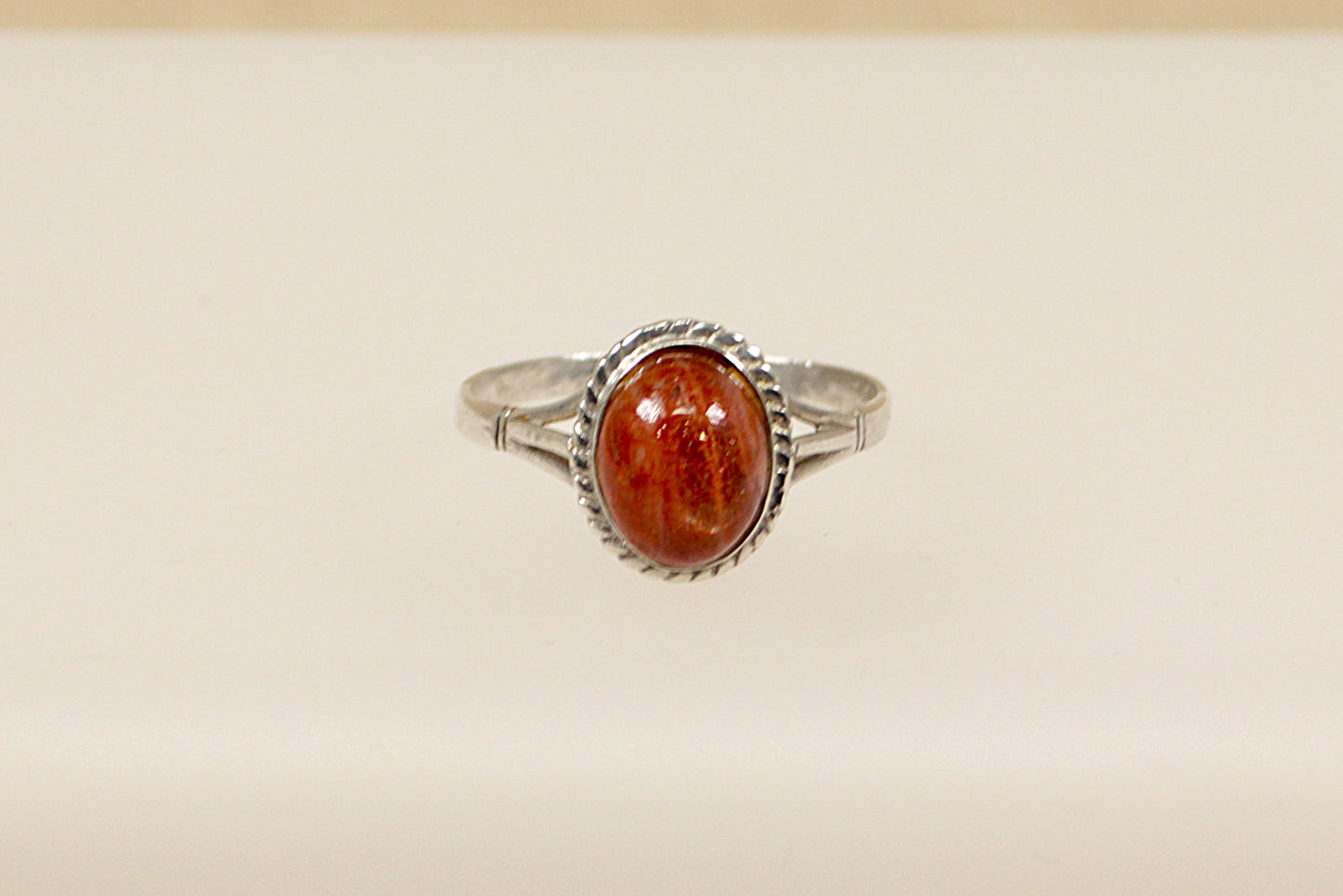 This pretty vintage silver ring has an oval Goldstone gemstone set in handcrafted silver. It is in excellent condition and inside the band it is stamped Silver. Head size: 13 x 11mm
UK Finger Size: V.