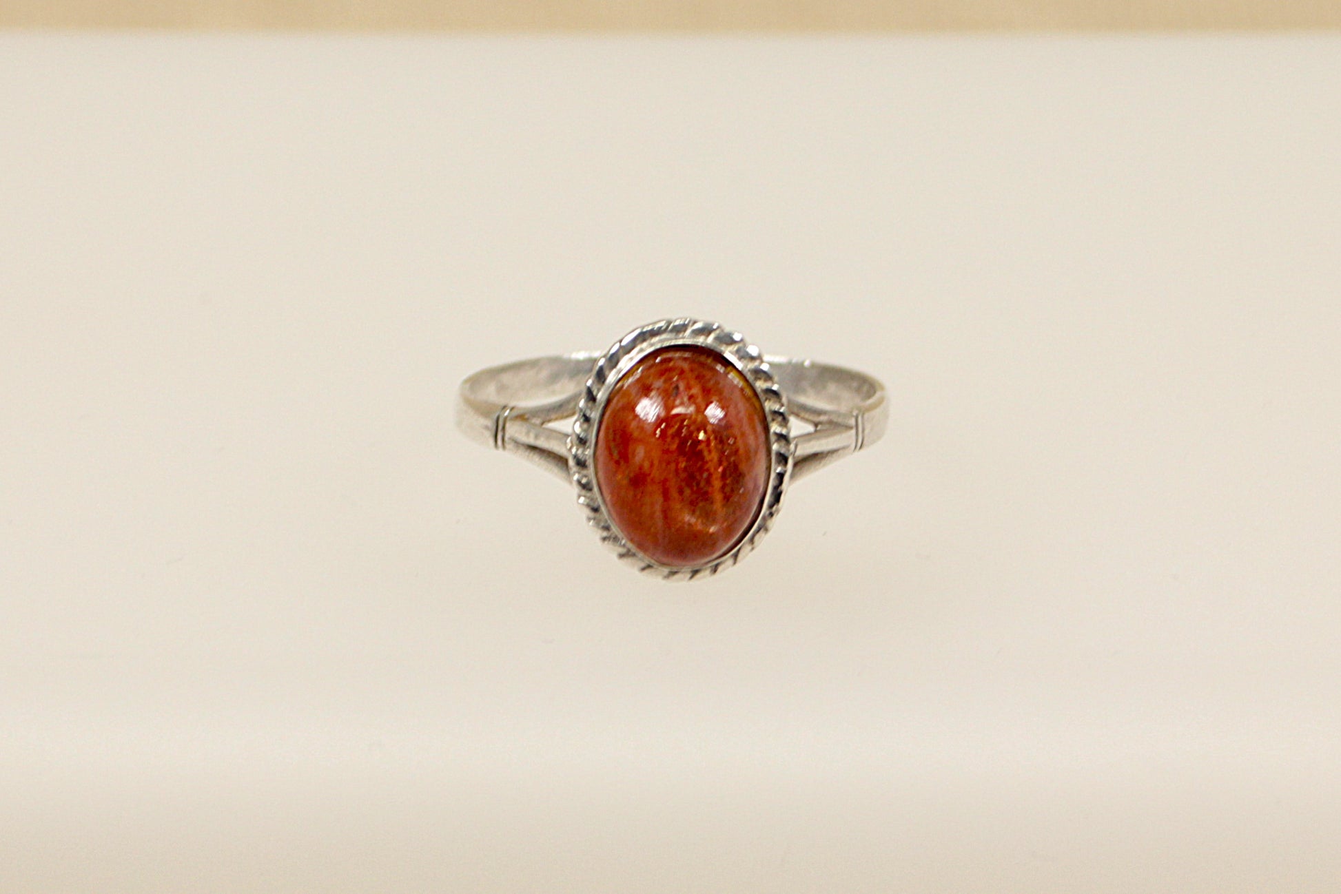 This pretty vintage silver ring has an oval Goldstone gemstone set in handcrafted silver. It is in excellent condition and inside the band it is stamped Silver. Head size: 13 x 11mm
UK Finger Size: V.