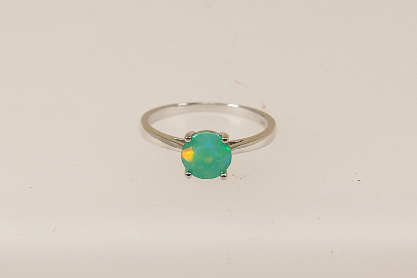 A sterling silver pre-owned green mystic crystal solitaire ring, UK finger size O, only nineteen pounds sterling.